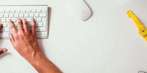 hands typing on a keyboard